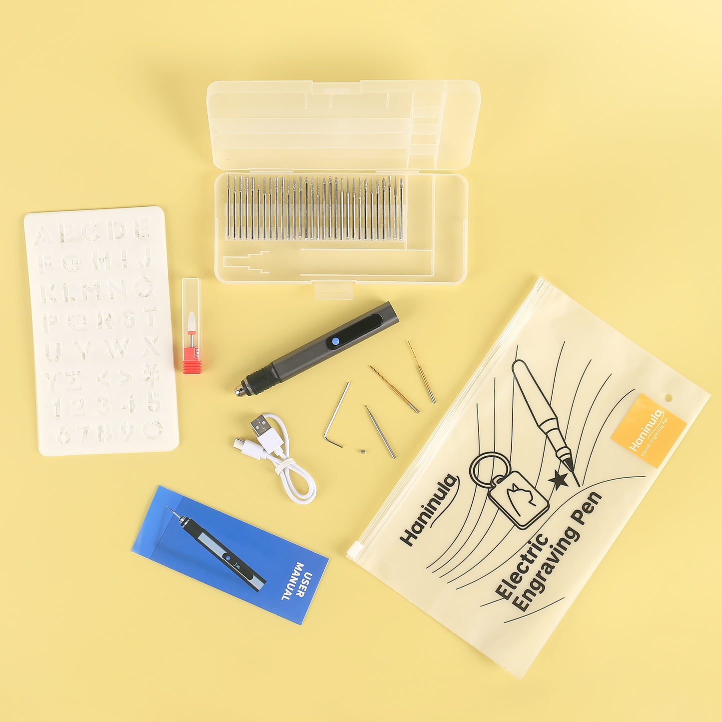 D2-002 electric engraving pen kit with accessories, stencil, bits, charging cable, and zippered pouch.