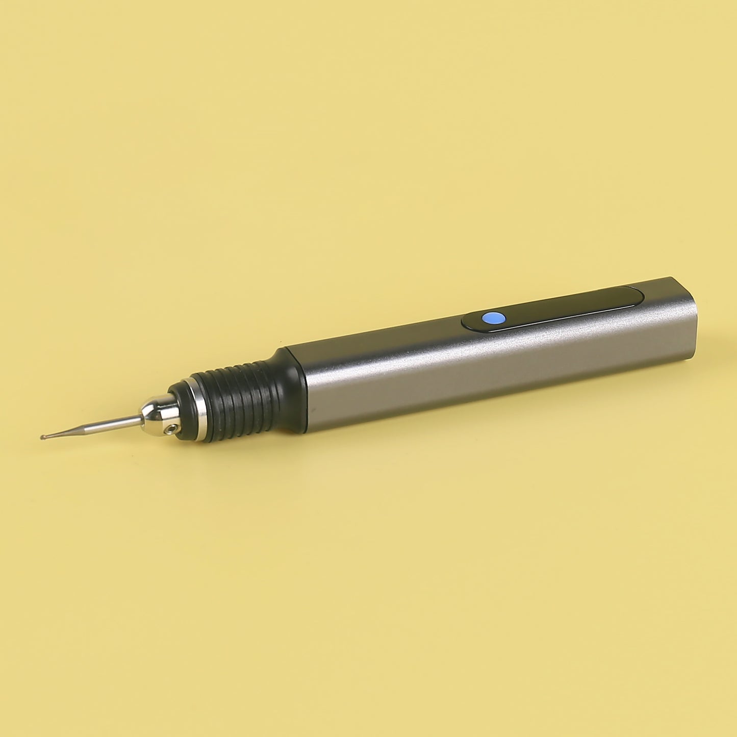 Side view of handheld D2-002 electric engraving pen with ergonomic grip and power button.