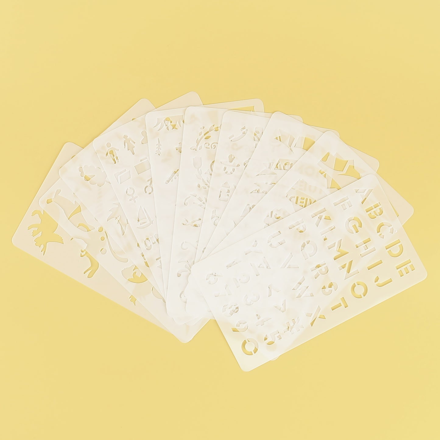 Plastic engraving stencils set with alphabet, numbers, and shapes – perfect for electric engraving pen beginners and crafting projects.