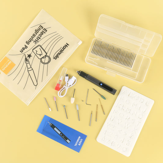 Full D2-003 engraving pen kit including engraving pen, diamond bits, grinding heads, stencil, USB cable, and user manual.
